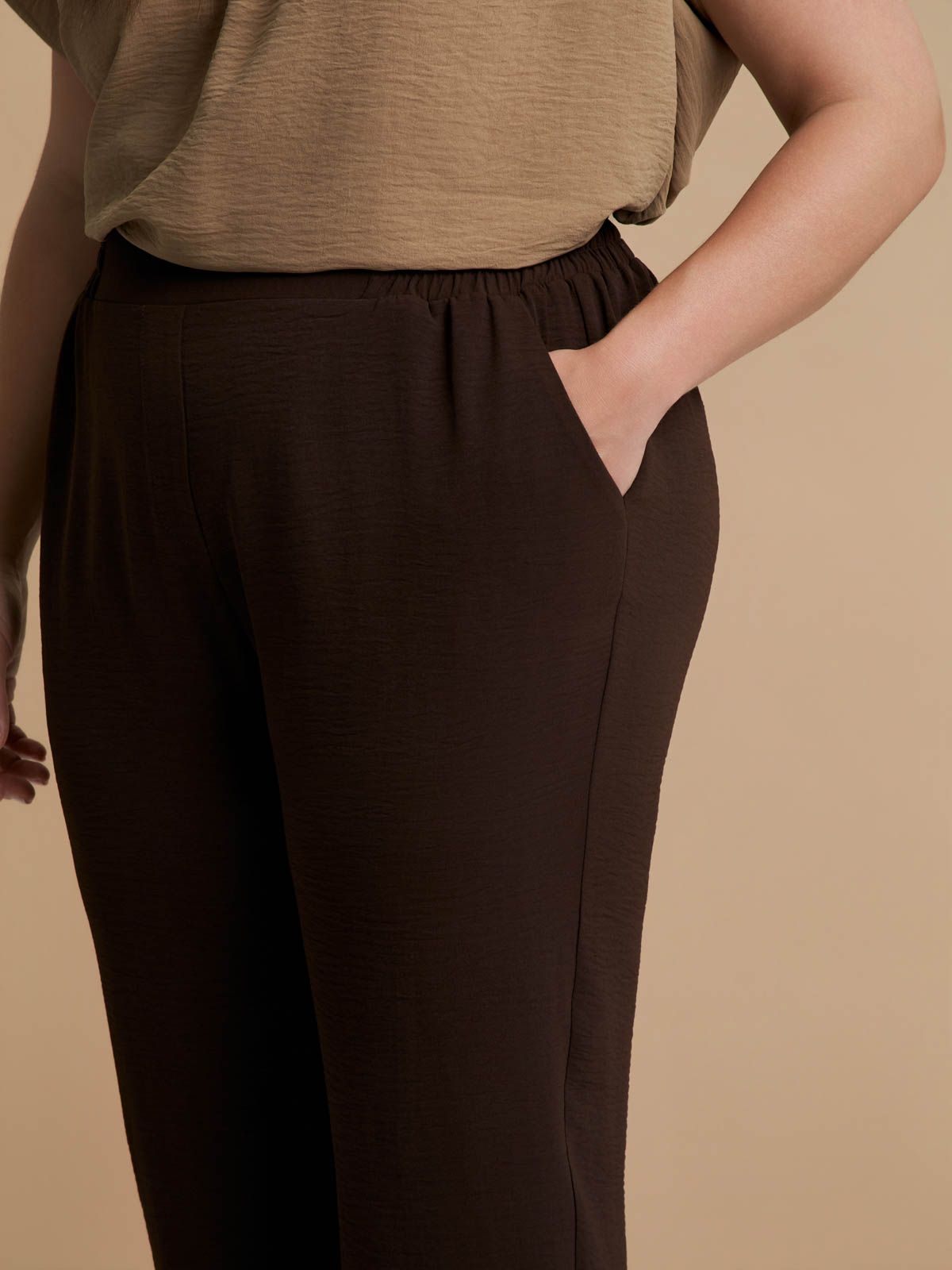 Airwashed crepe tapered-leg trousers