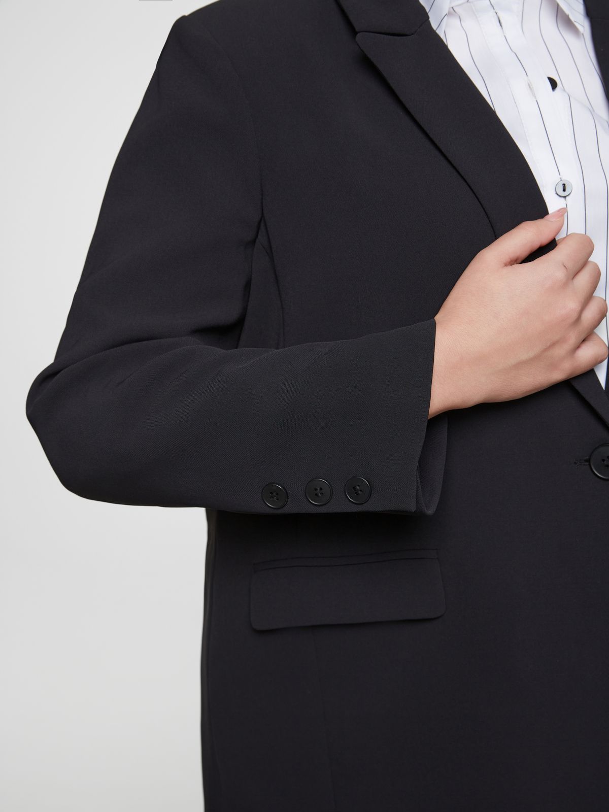 Black blazer with single button closure