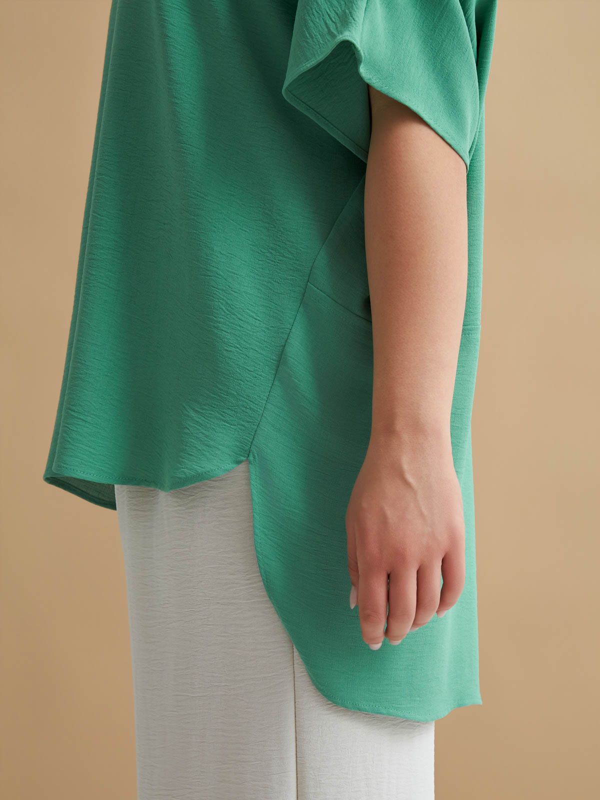 Crepe blouse with dipped back