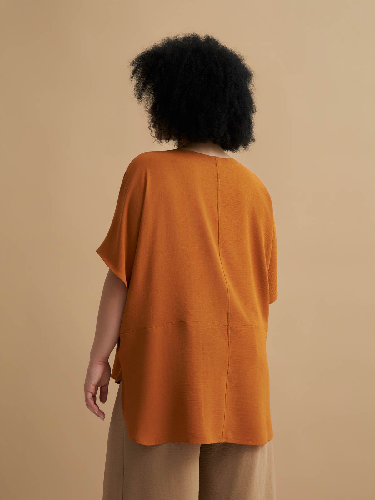 Crepe blouse with dipped back