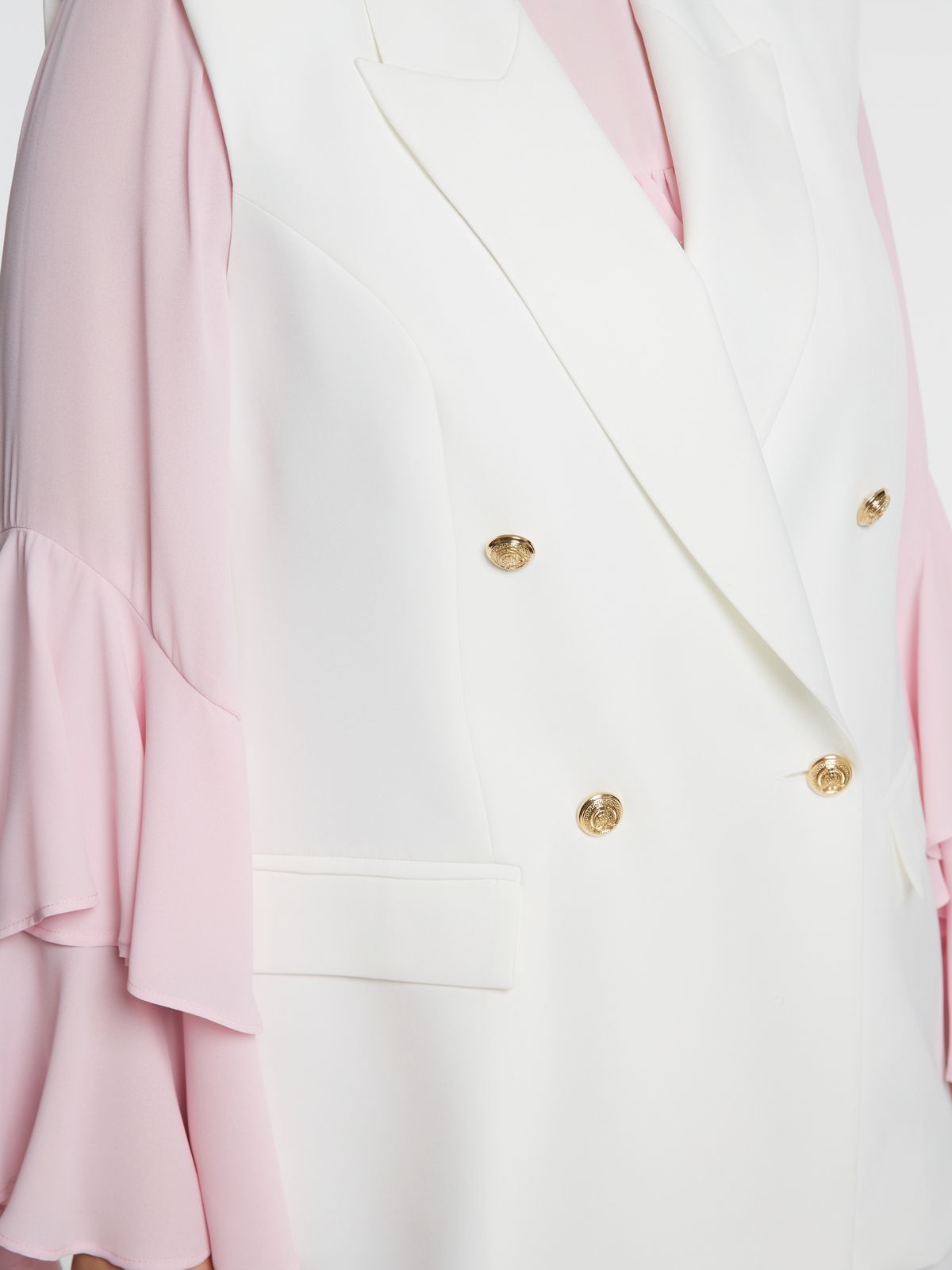Double-breasted sleeveless blazer with structured lapels