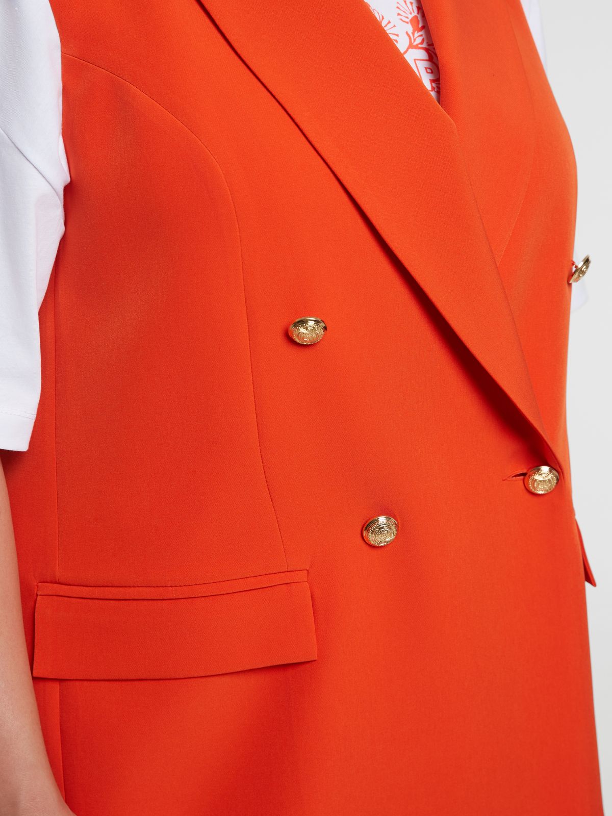 Double-breasted sleeveless blazer with structured lapels