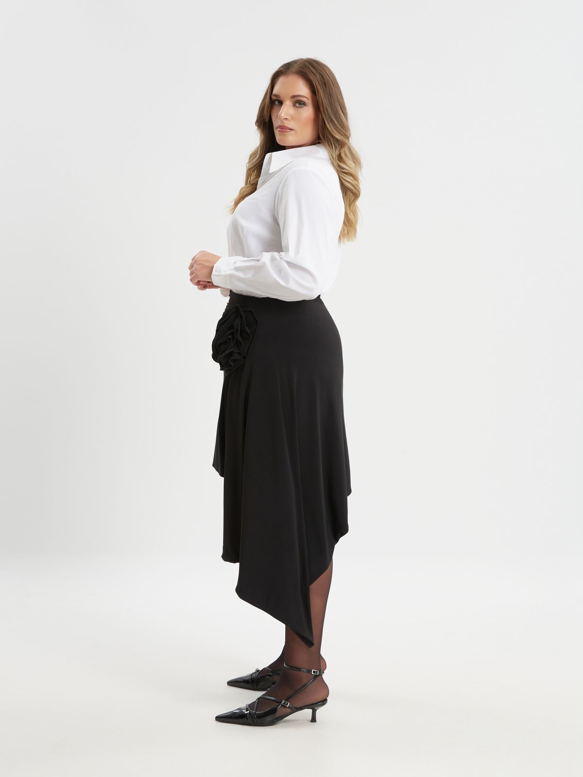 Black asymmetric skirt with floral detail and draped hem