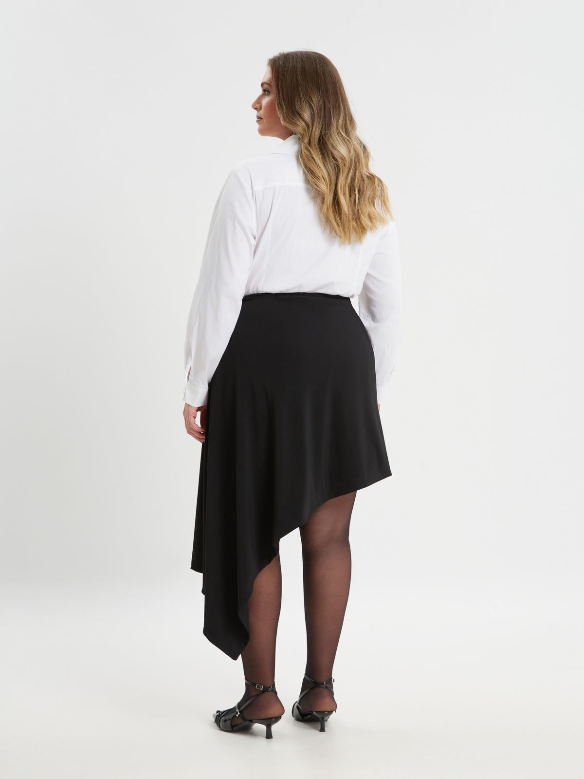 Black asymmetric skirt with floral detail and draped hem