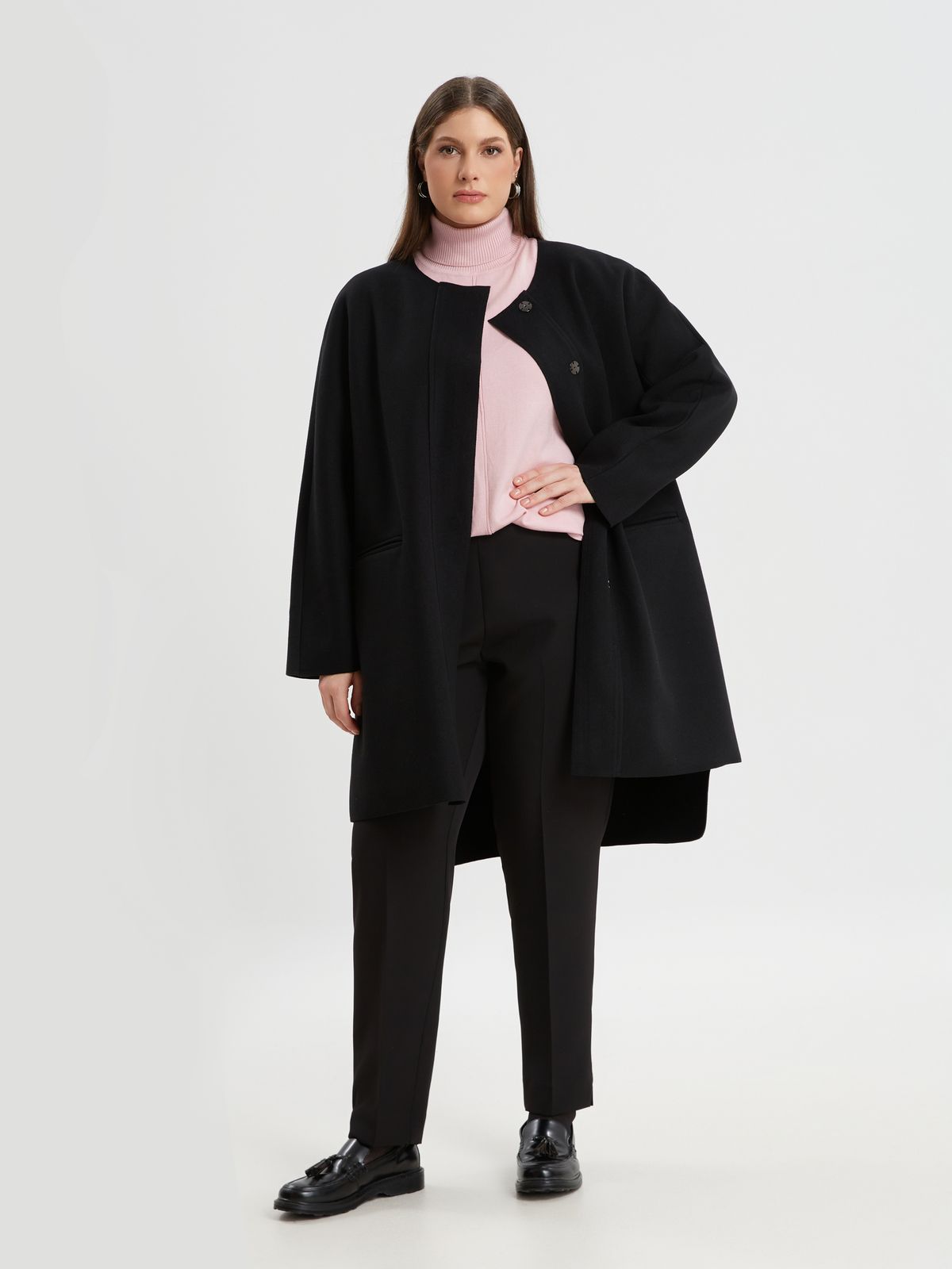 Oversized coat with button-up closure
