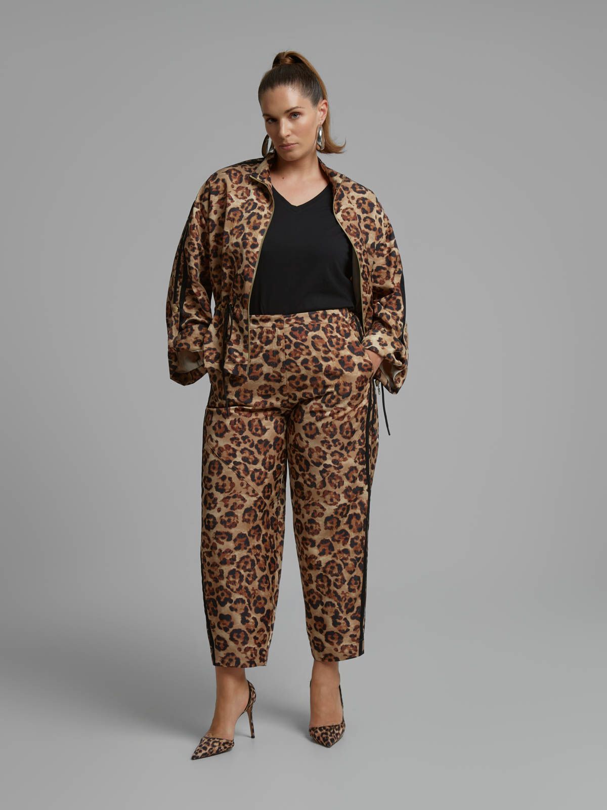 Leopard print tapered trousers with side stripe detail