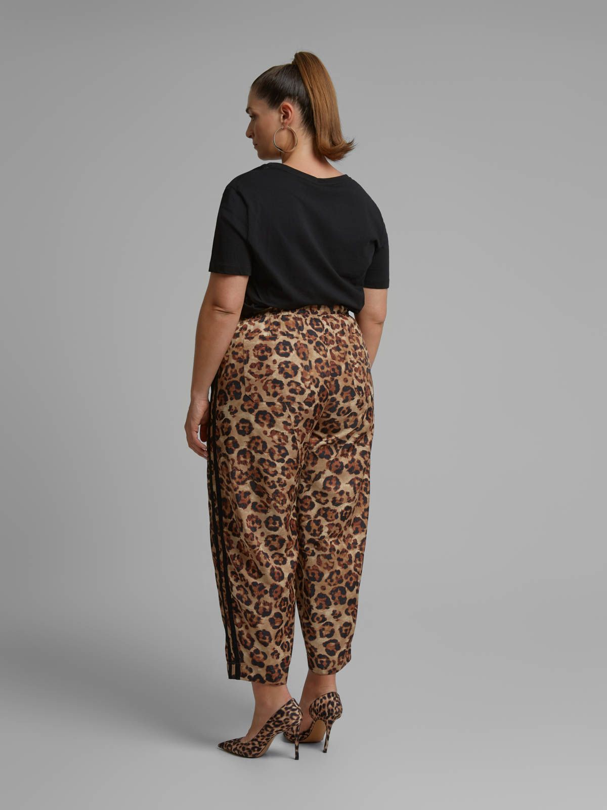Leopard print tapered trousers with side stripe detail