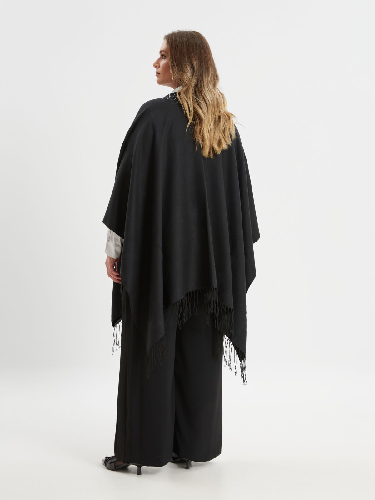 Black cape with pearl detail and fringe