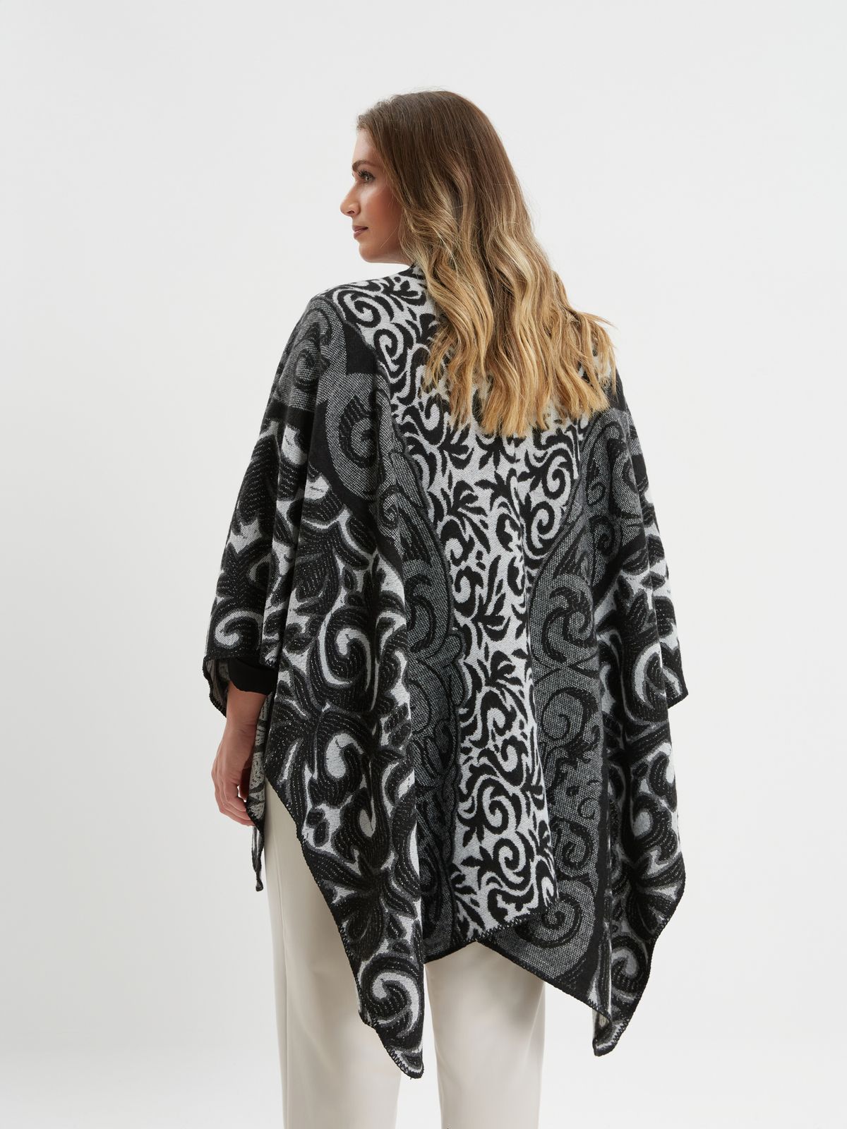 Black and grey patterned poncho