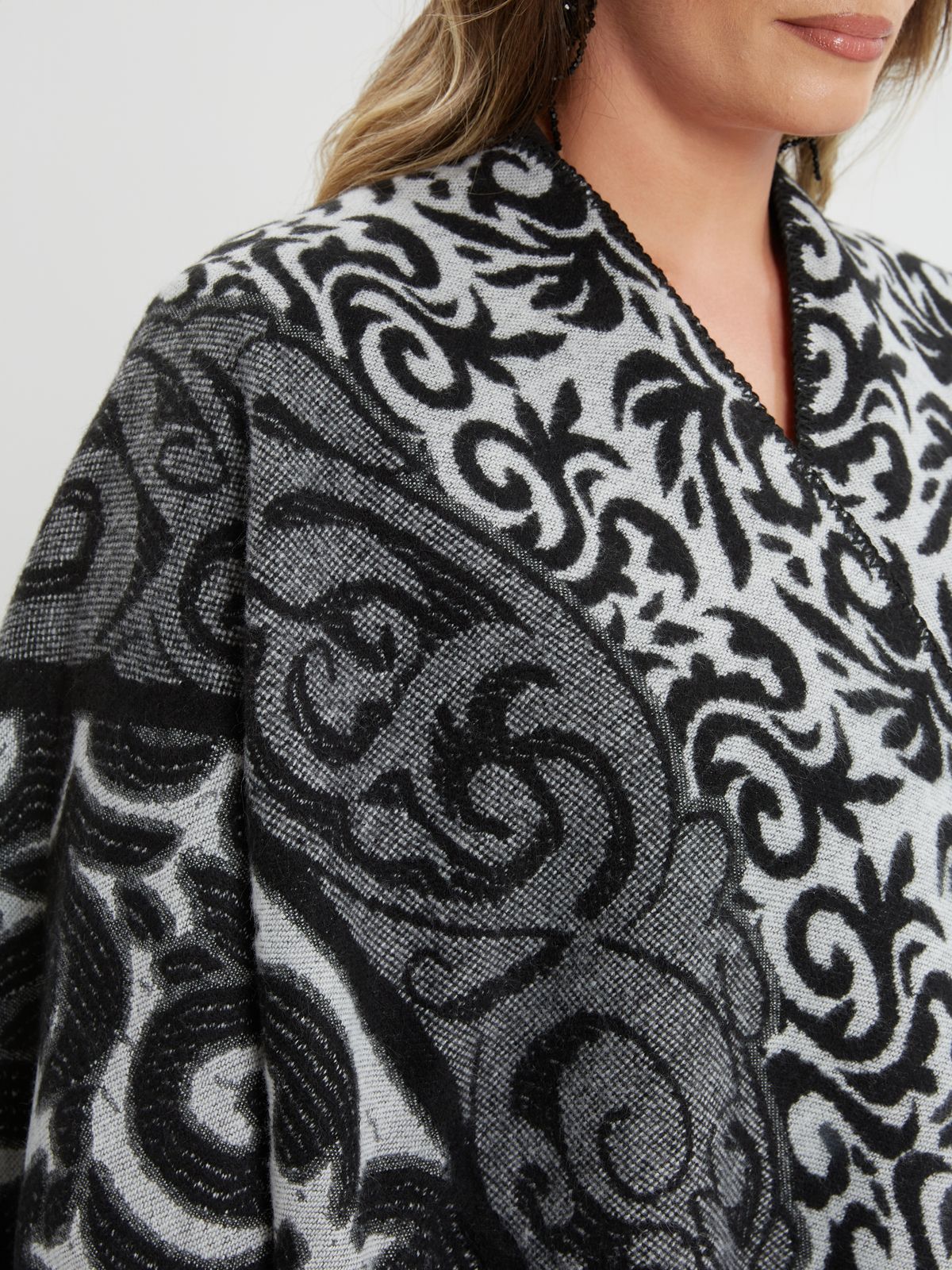 Black and grey patterned poncho