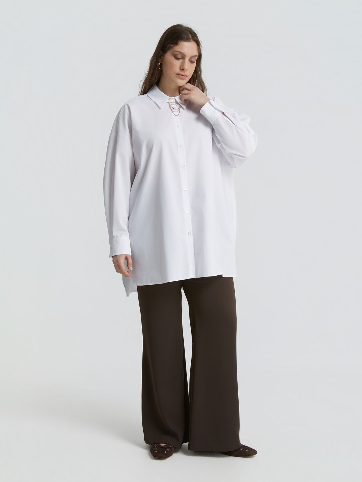 White shirt with decorative chain detail