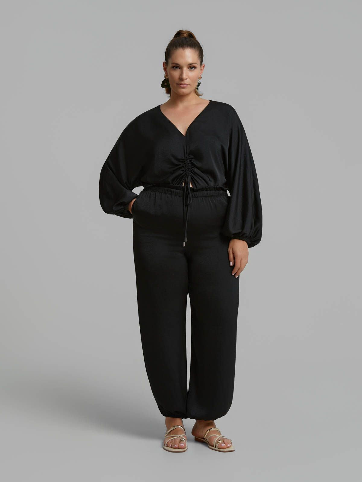 Satin tapered trousers with elastic hem