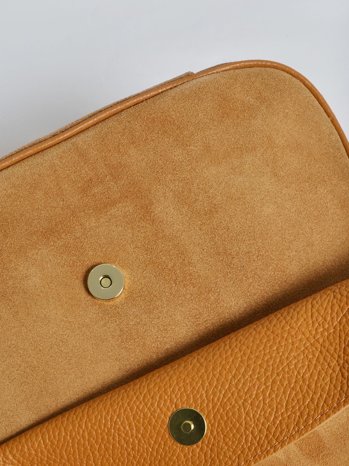 Leather shoulder bag with flap closure