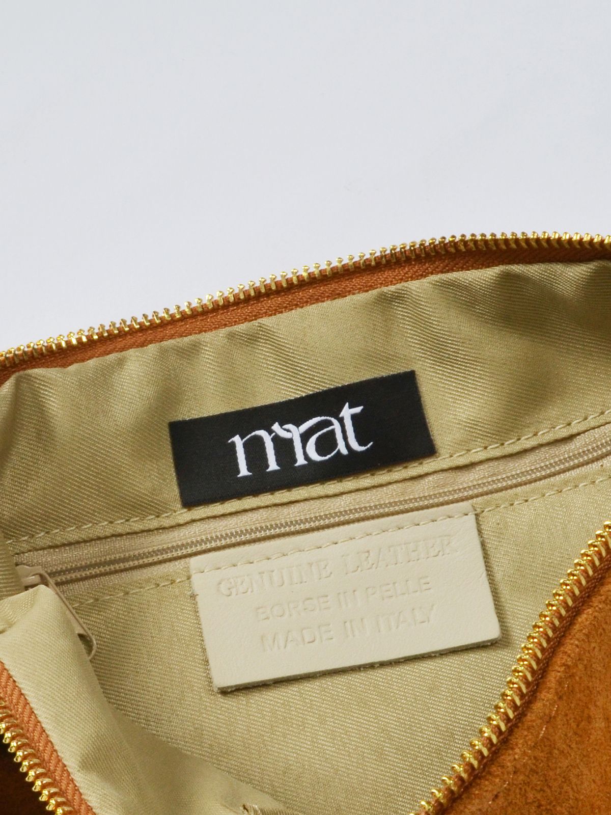 Suede leather shoulder bag with knotted handles