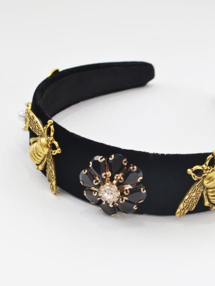 Velvet headband with black and gold embellishments
