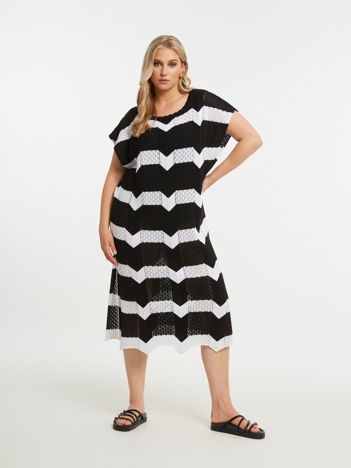 Πλεκτό midi φόρεμα με ρίγες φωτογραφία