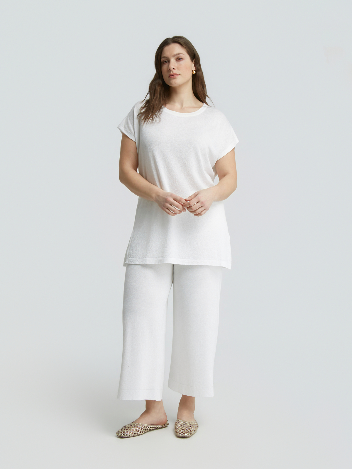 Πλεκτό longline τοπ με lurex φωτογραφία