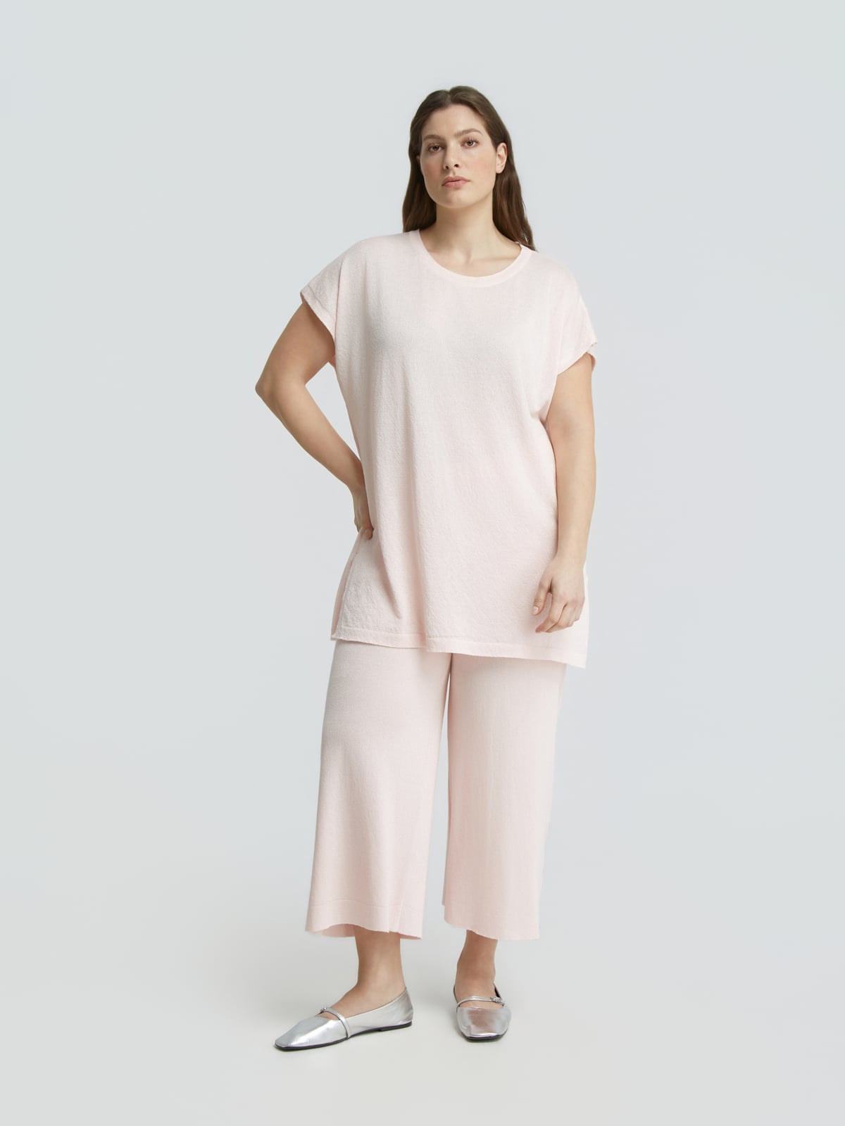 Πλεκτό longline τοπ με lurex φωτογραφία