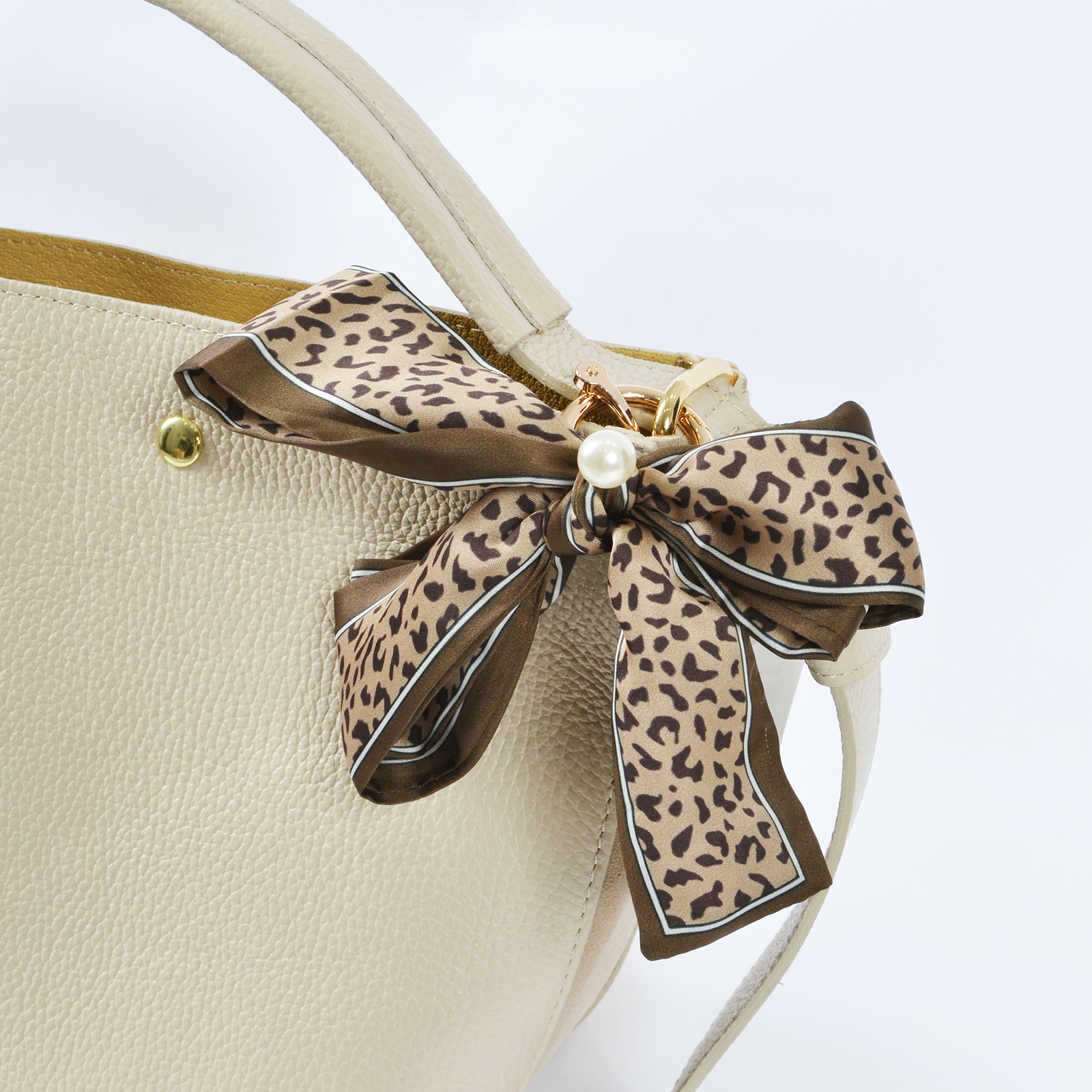 Leopard print bow bag charm with pearl detail