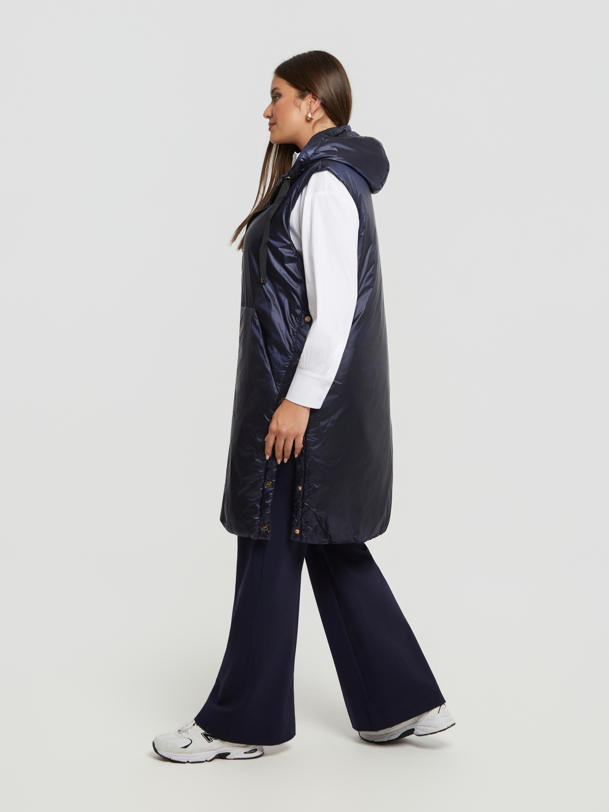 Μακρύ αμάνικο puffer γιλέκο με κουκούλα φωτογραφία