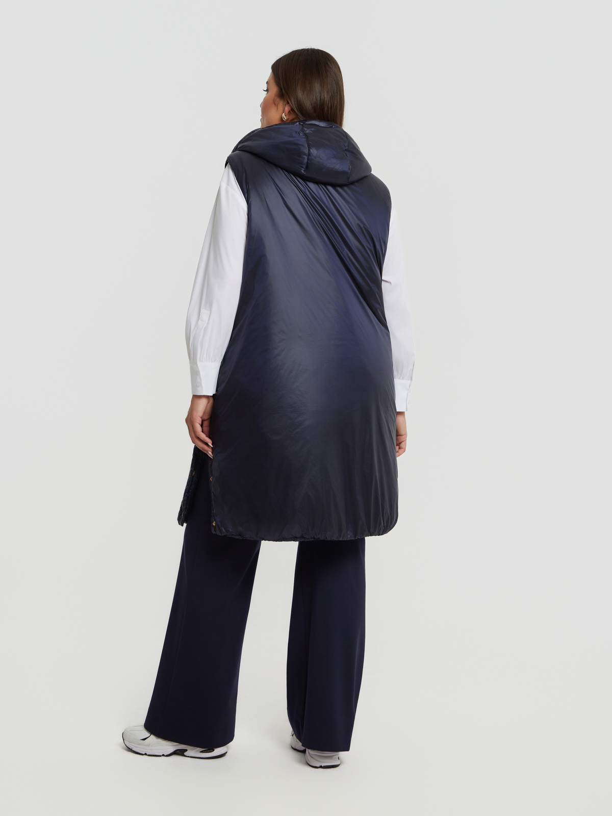 Μακρύ αμάνικο puffer γιλέκο με κουκούλα φωτογραφία