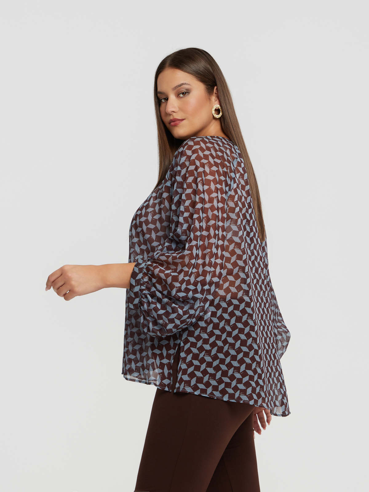 Διαφανής μπλούζα με γεωμετρικό σχέδιο & μπαλούν μανίκια φωτογραφία