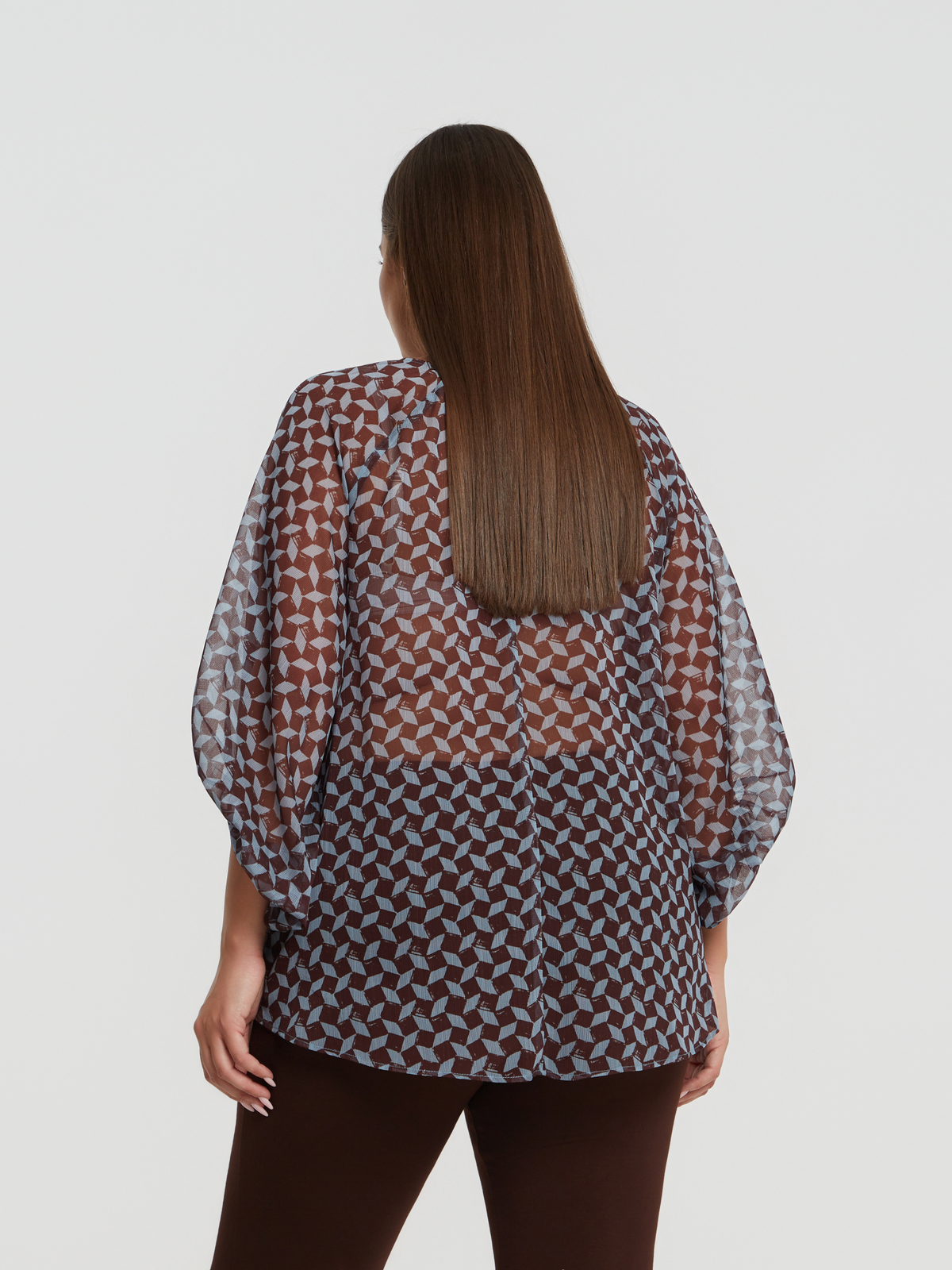 Διαφανής μπλούζα με γεωμετρικό σχέδιο & μπαλούν μανίκια φωτογραφία