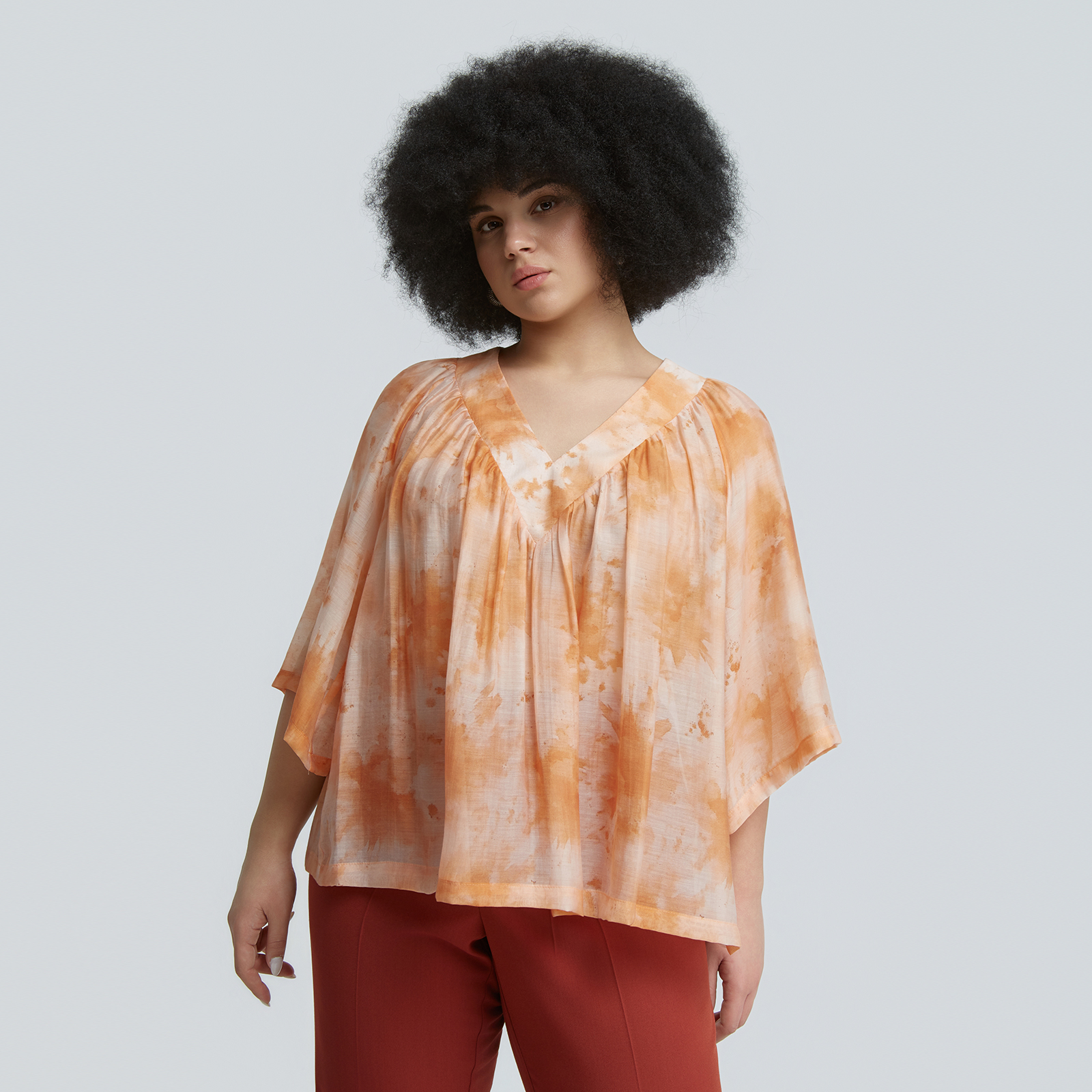 Pleated V-neck tie-dye blouse