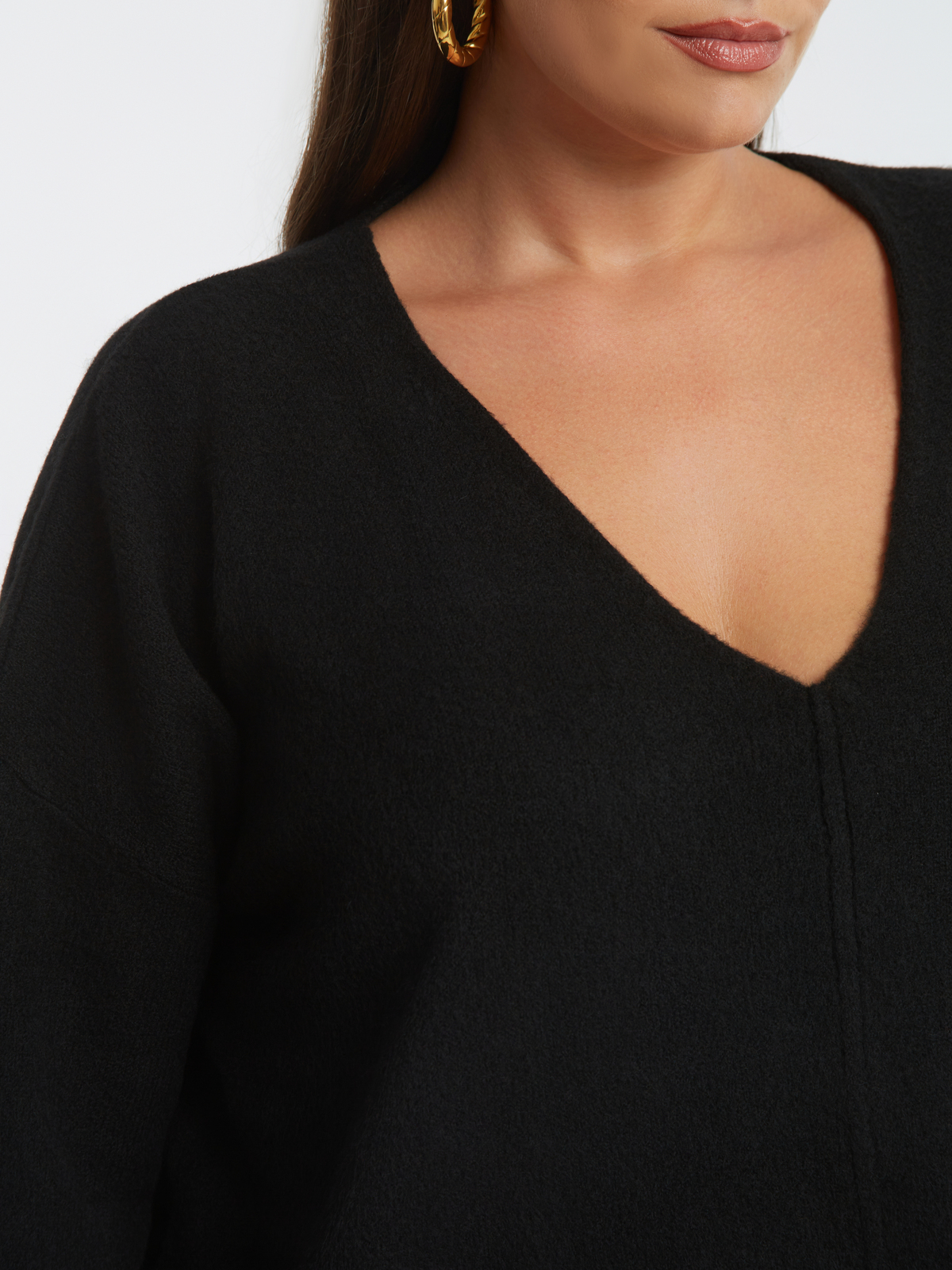 Πλεκτή μπλούζα με V-λαιμόκοψη και χαλαρή γραμμή φωτογραφία