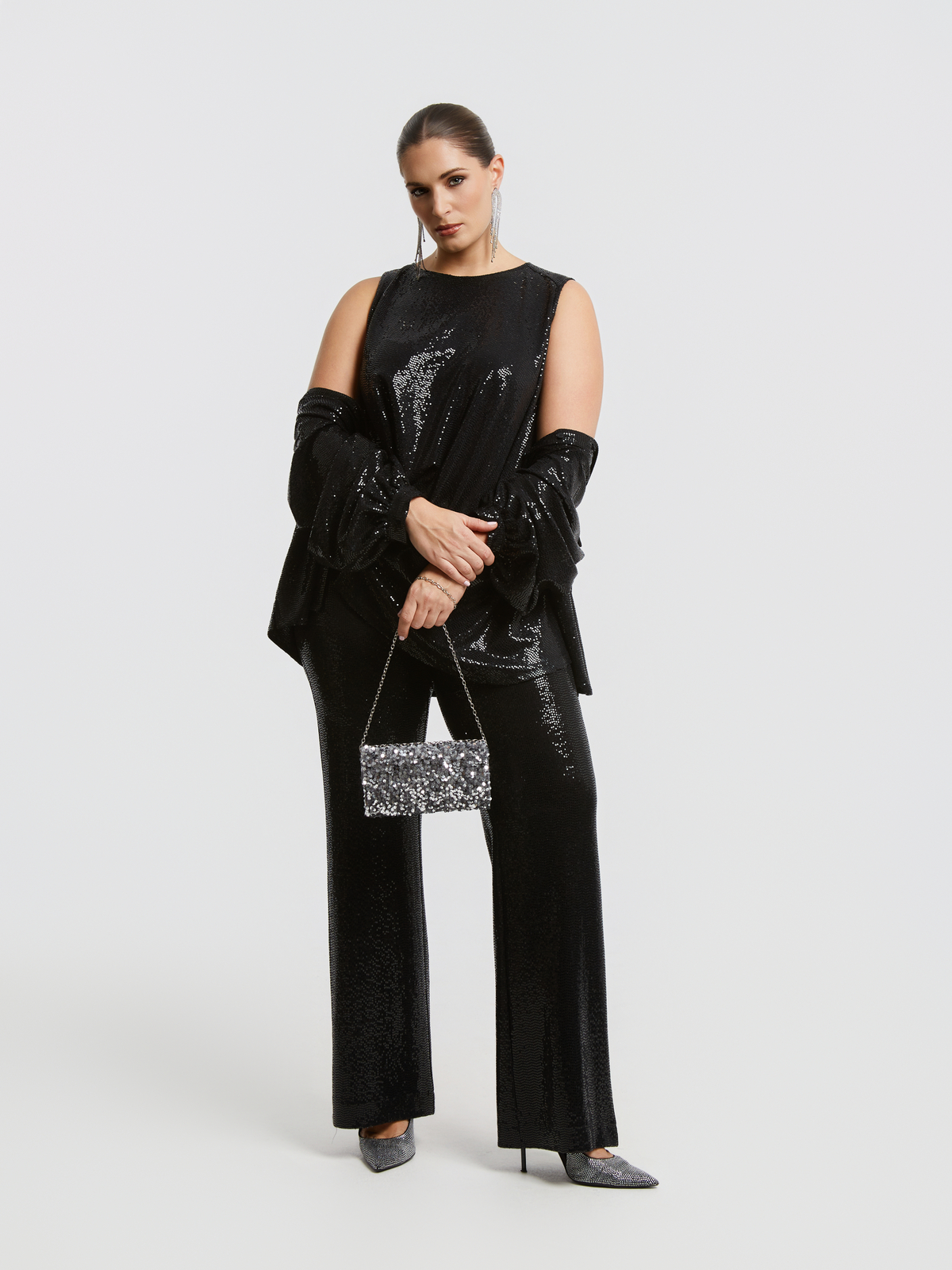 Ασύμμετρο αμάνικο τοπ με παγιέτες φωτογραφία