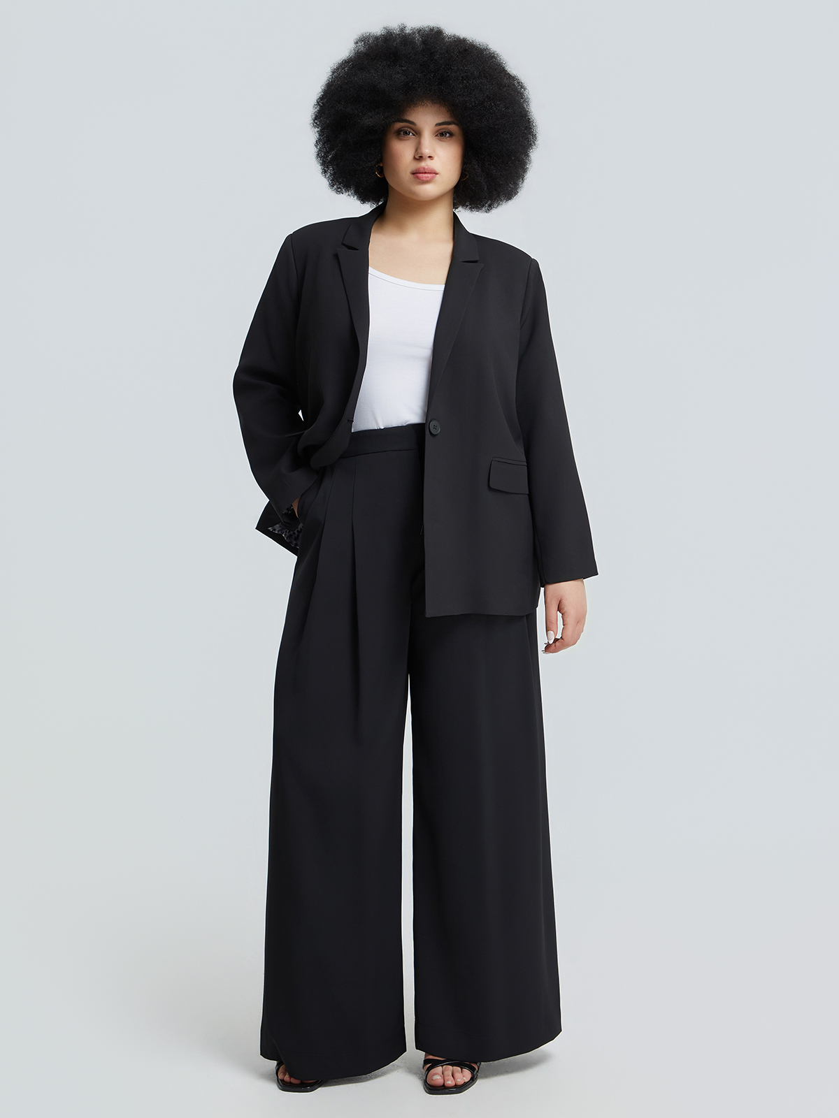 Μονόχρωμο σακάκι με εμπριμέ φόδρα και κουμπί φωτογραφία