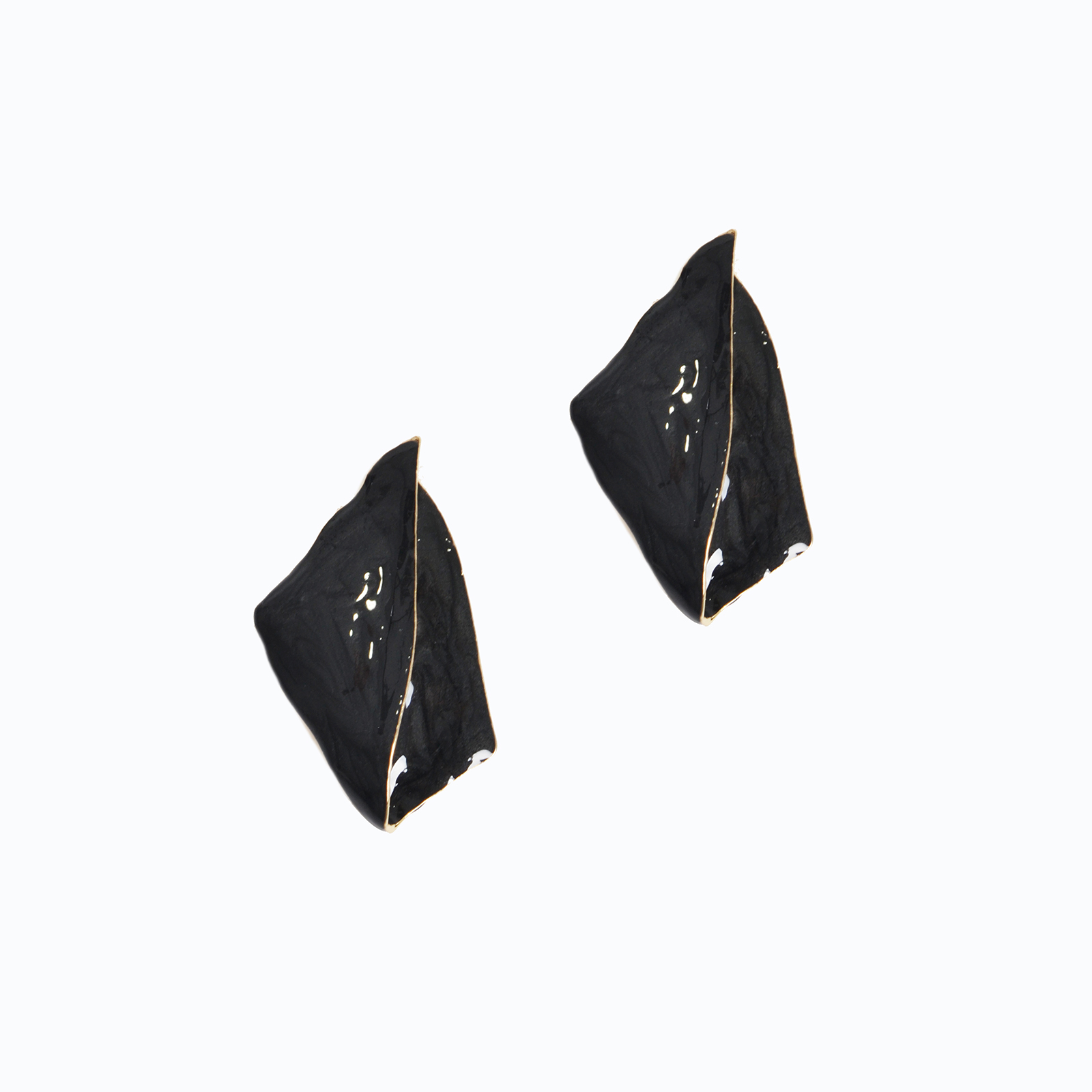 Sculptural earrings in black with gold edging